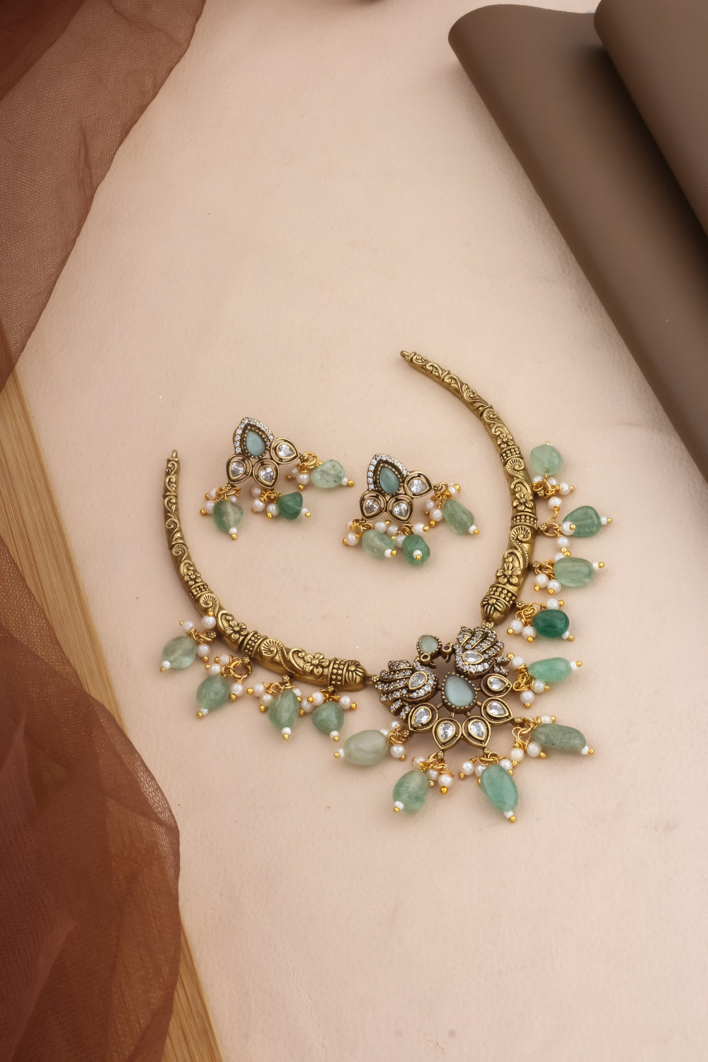 mint hansuli with cz kundan peacock design