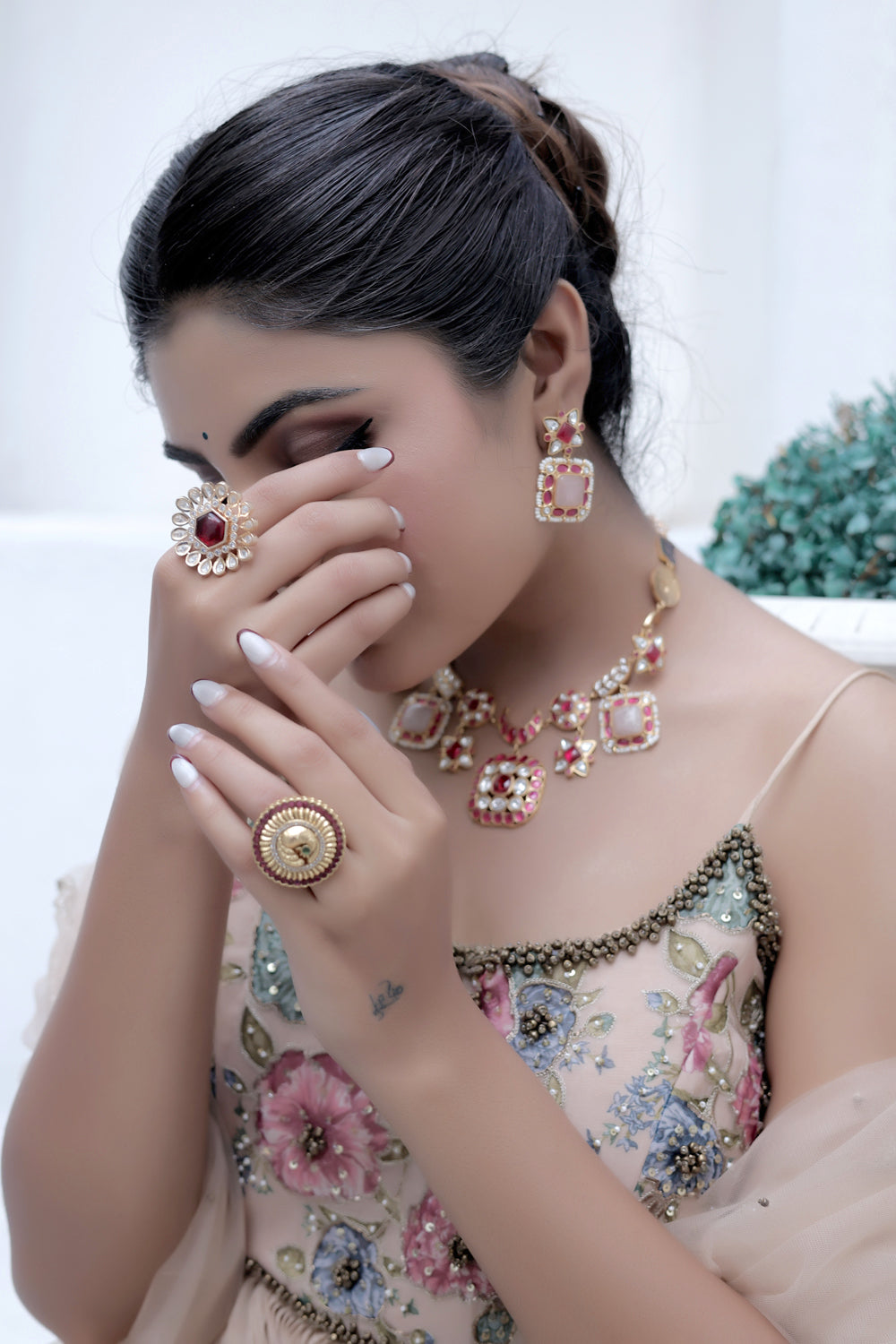 model wearing indian jewellery in pastel shades
