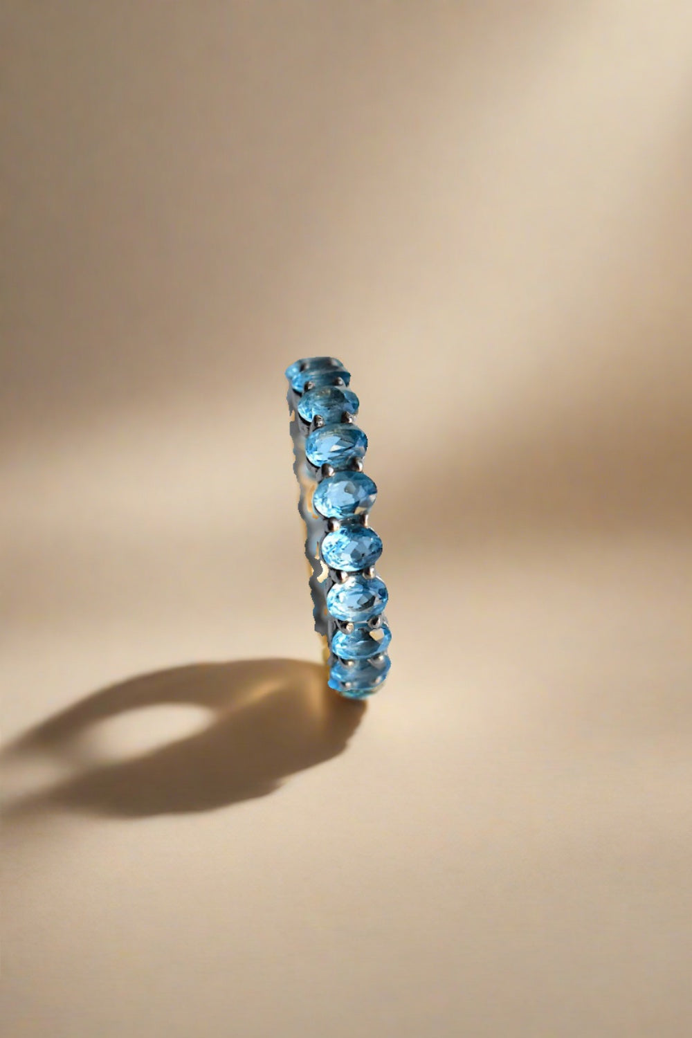 blue topaz finger band