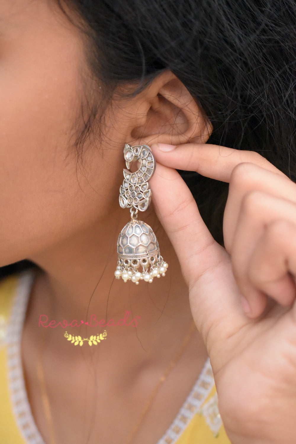 stone studded jhumka earrings