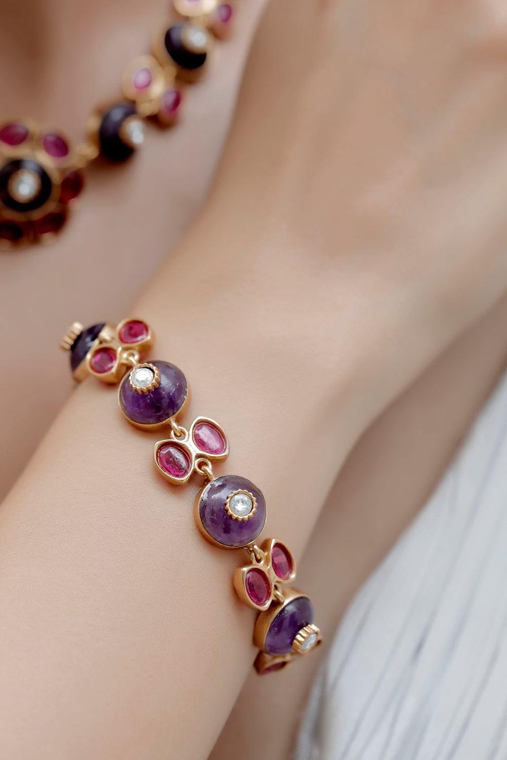 semi precious amethyst stone with inlay work and pota ruby kundan stones in matte gold polish art jewellery indian premium statement contemporary bespoke jewellery