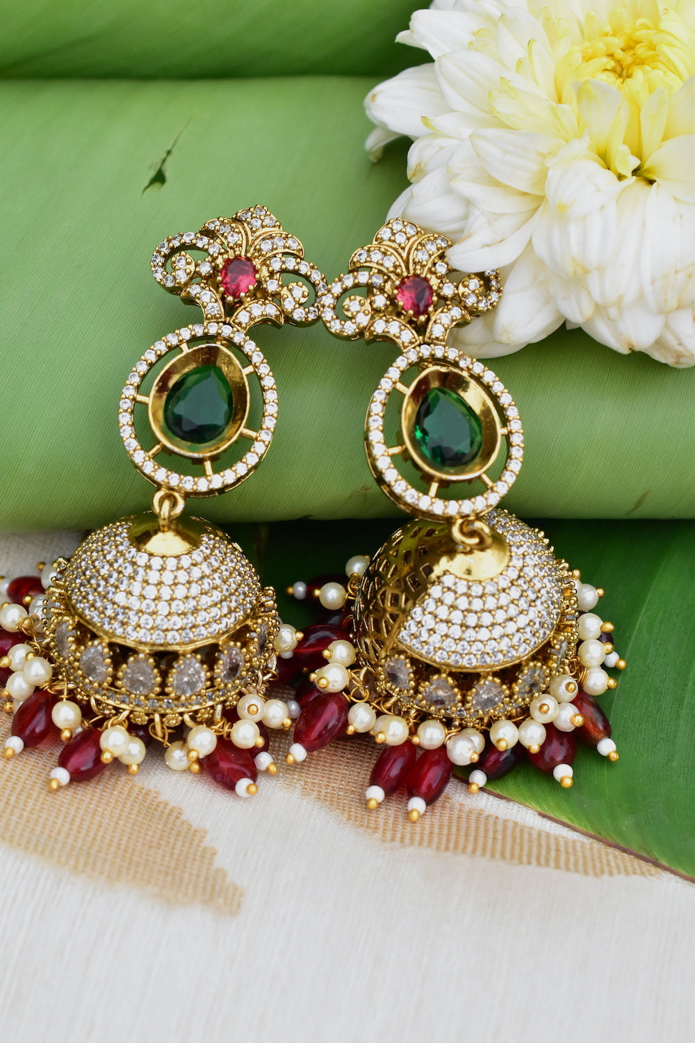 long cz gold jhumka earrings