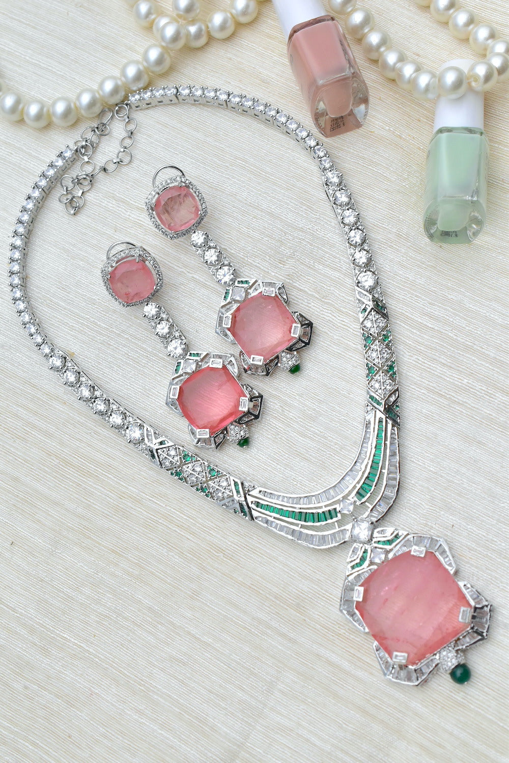 Necklace with american diamonds, pink stones and green accents in silver finish