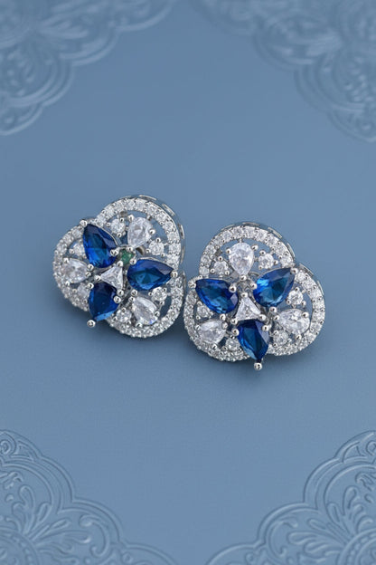 Pair of delicate diamond stud earrings with blue gemstones 