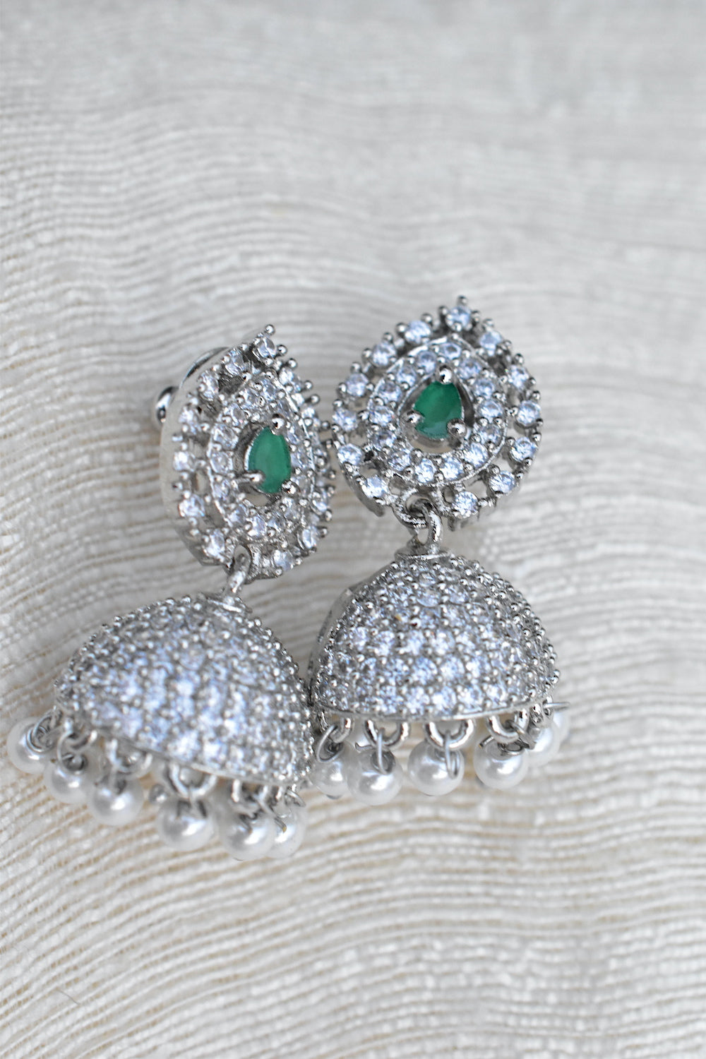 Silver earrings with green gemstones