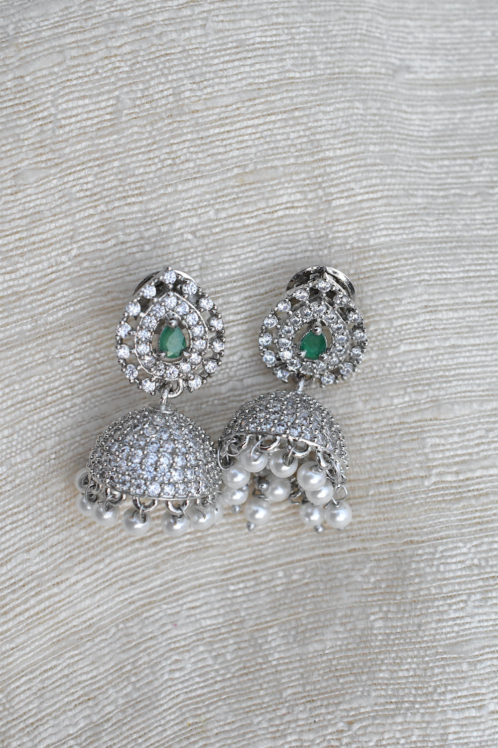 Silver earrings with green gemstones and pearl