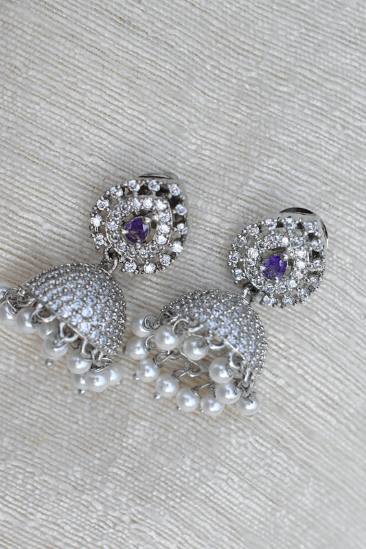 Silver earrings with purple gemstones and pearl accents