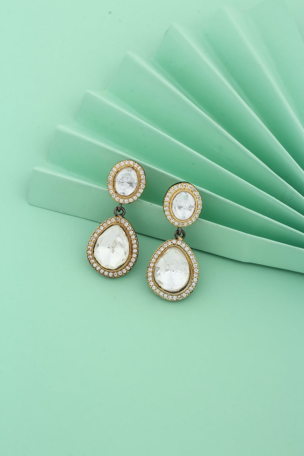 black polish drop earrings with dual tone gold black polish and cubic zirconia stones