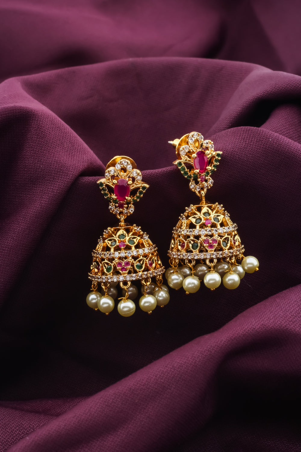 Ad zircon antique gold finish delicate jhumka earrings