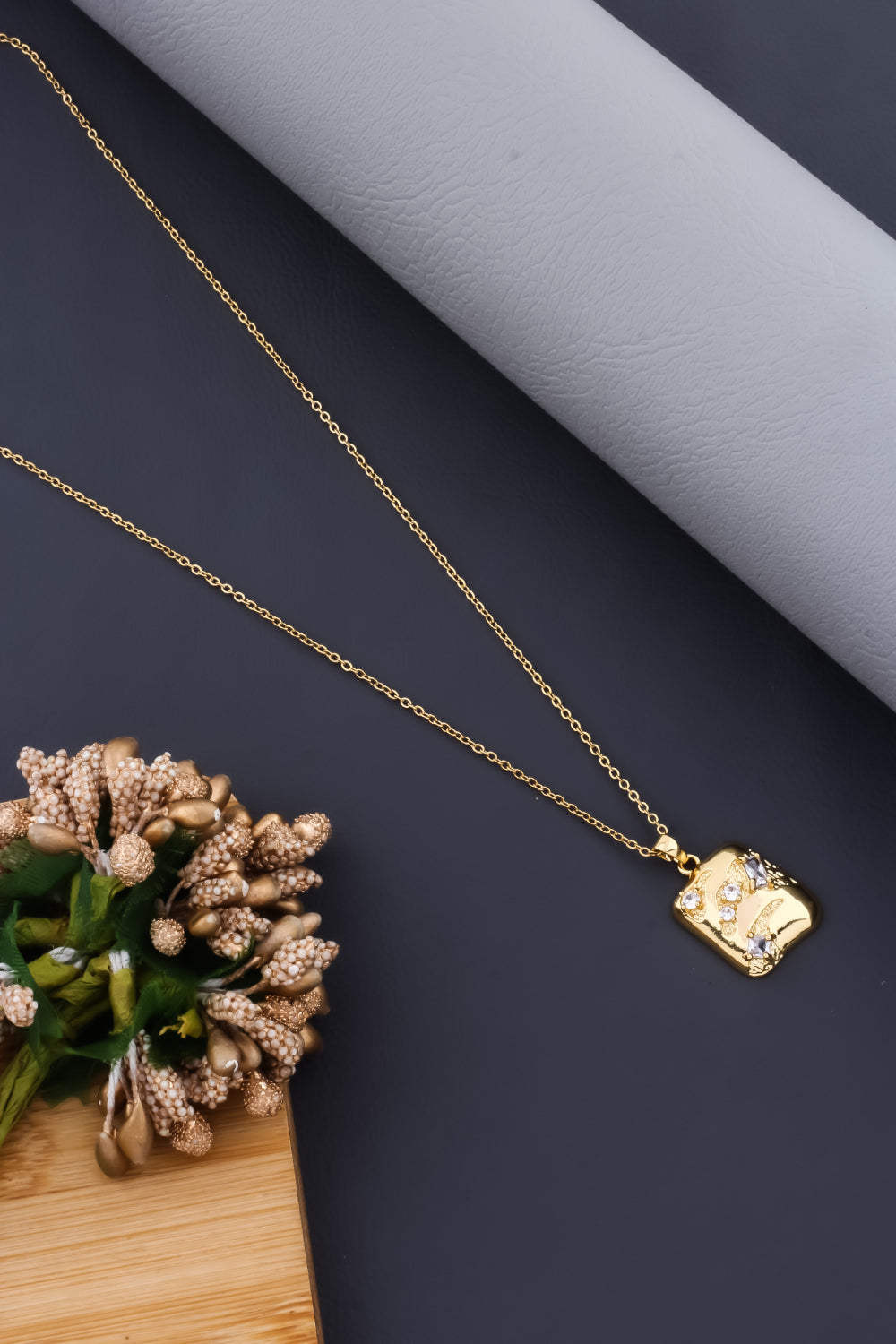 organic shape cz stone studded stainless steel rectangle pendant chain in gold finish minimal