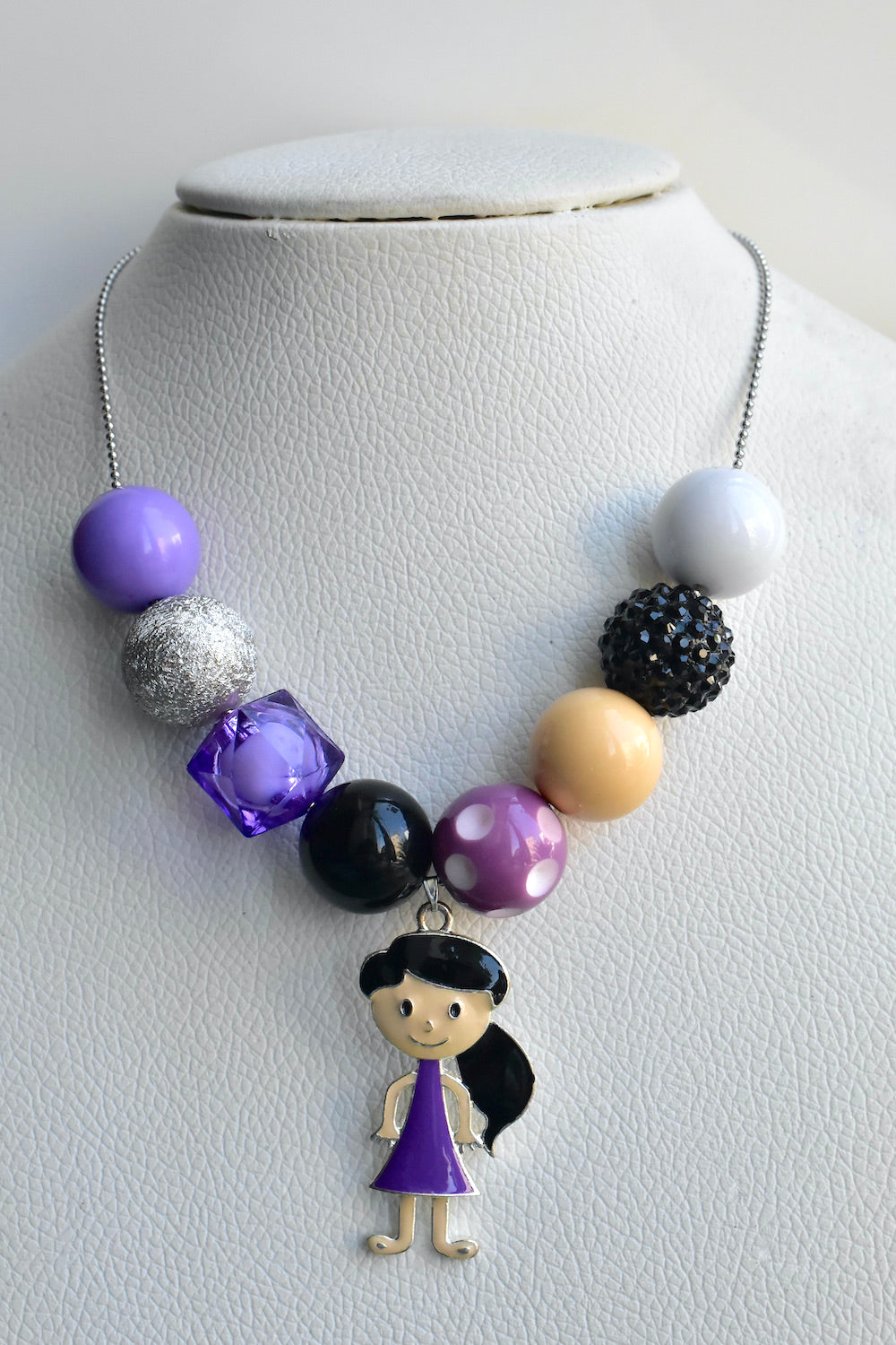 girl in purple kids necklace